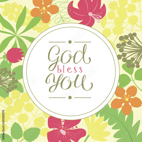 Hand lettering God bless you, is made on a floral background.