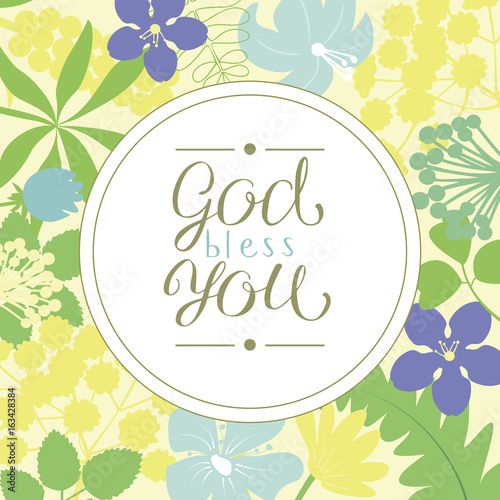 Hand lettering God bless you, is made on a floral background.