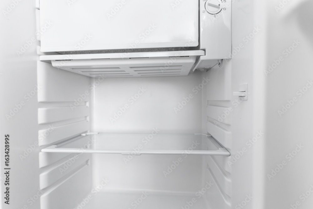 White open empty refrigerator. White open empty refrigerator.