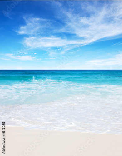 Tropical white sand beach and blue sky at summer sunny day. Seychelles