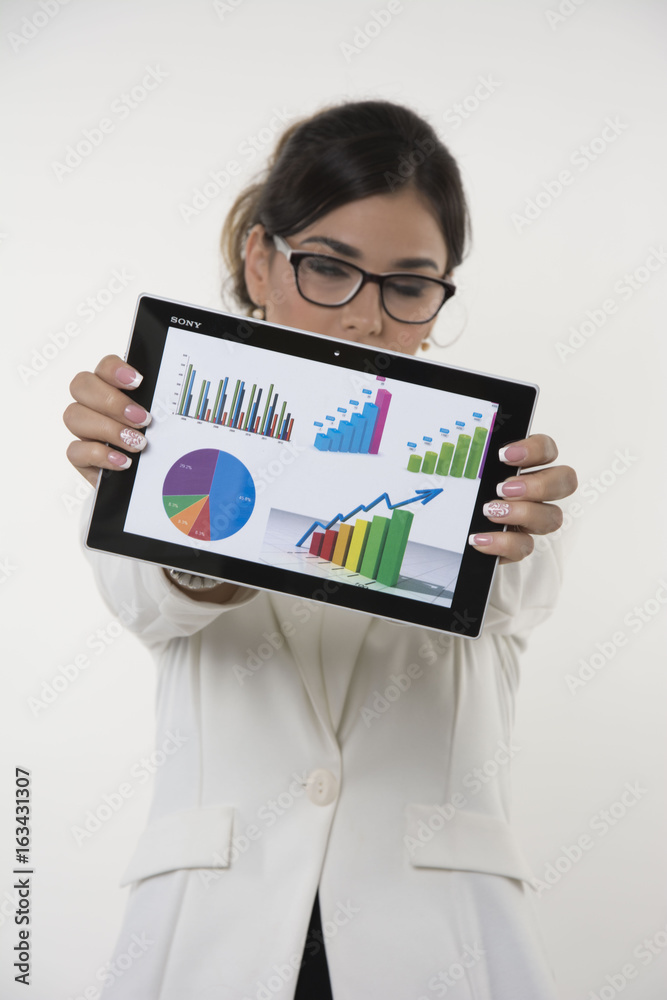 business woman with glasses and graphic data on tablet