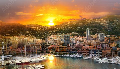 Monaco at sunset. Main marina of Monte Carlo with luxury yachts and sail boats at sunset photo
