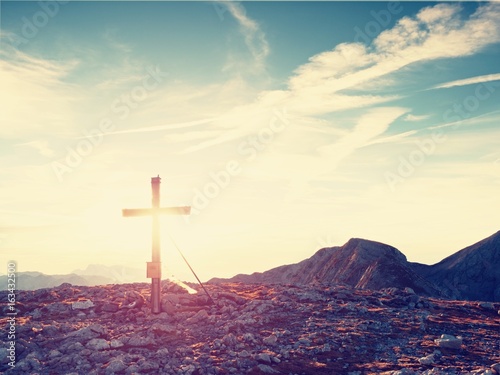 Traditional cross at mountain top in Alp. Cross monument to the dead climbers
