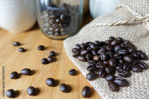 Coffee beans on a sack and table