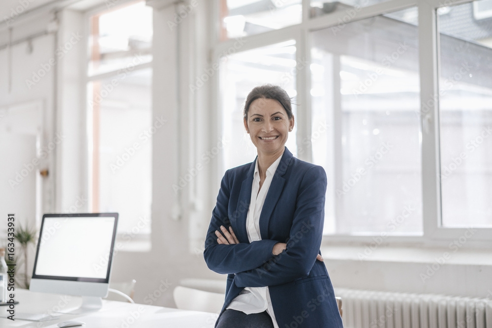Portrait of smiling businesswoman in an office Portrait of smiling businesswoman in an office