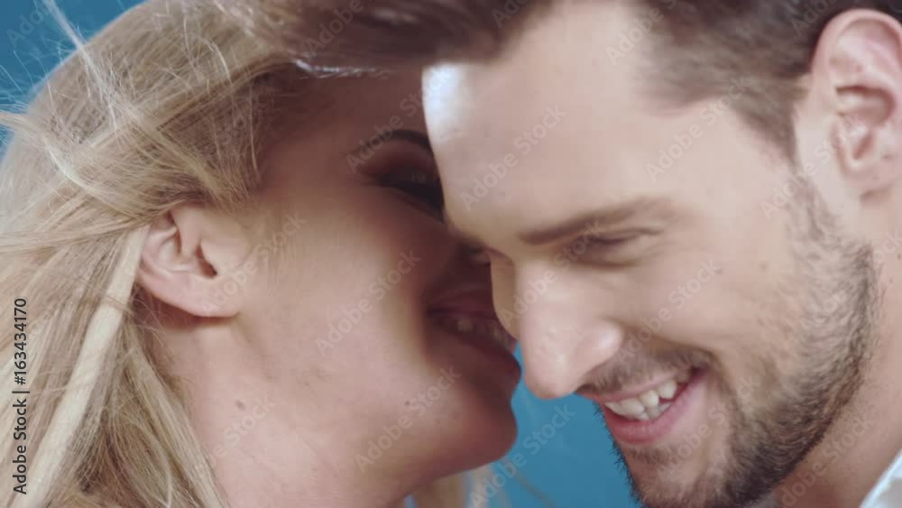 Sexy young couple posing on studio background, 4k slow motion studio clip Sexy young couple posing on studio background, 4k slow motion studio clip