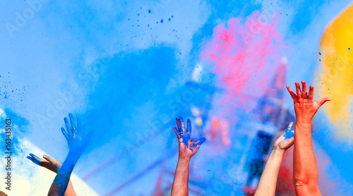 Fototapeta Naklejka Na Ścianę i Meble -  Hands up on color Holi Festival