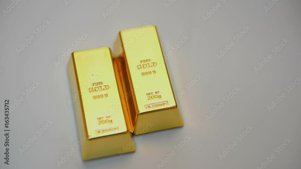 Gold ingots on white background Gold ingots on white background