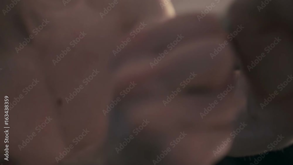 Man squeezes and unclenches his hands close up Man squeezes and unclenches his hands close up