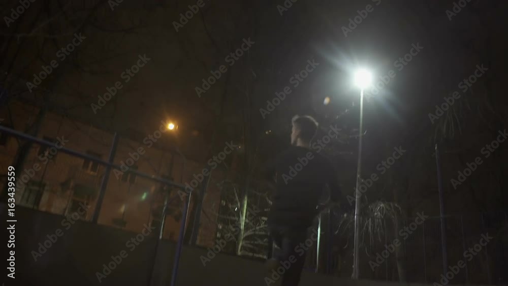 Dancer man kneads on the street at night Dancer man kneads on the street at night