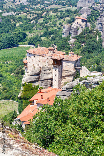 Aerial daylight view on monastery at coast of mountains. Greece, Corfu