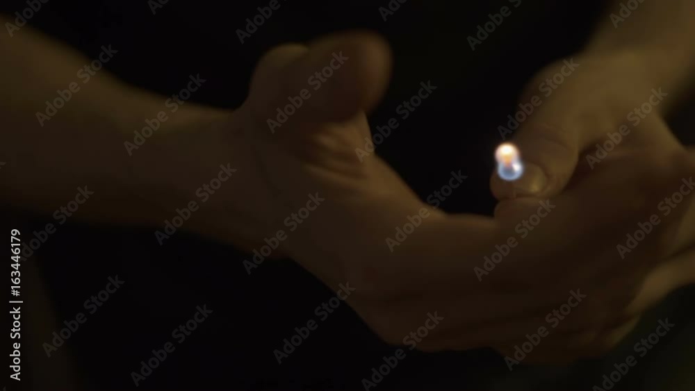 Burning match in the hands close up Burning match in the hands close up