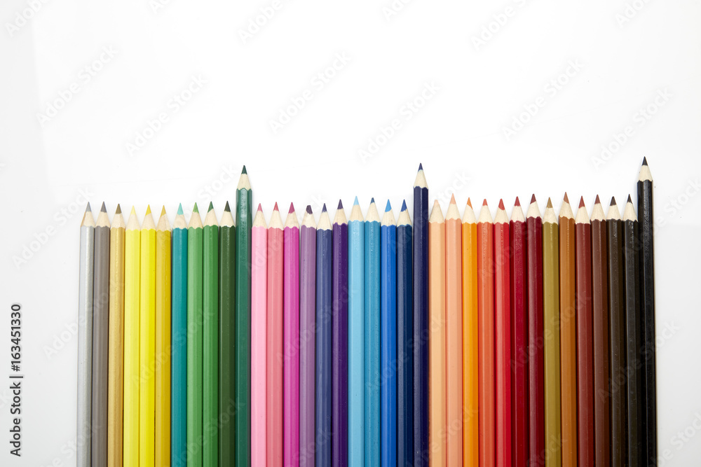Many different colored pencils on white background Many different colored pencils on white background
