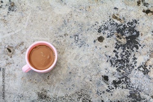 coffee cup pink plastic on the Cement  floor old with copy space © pramot48