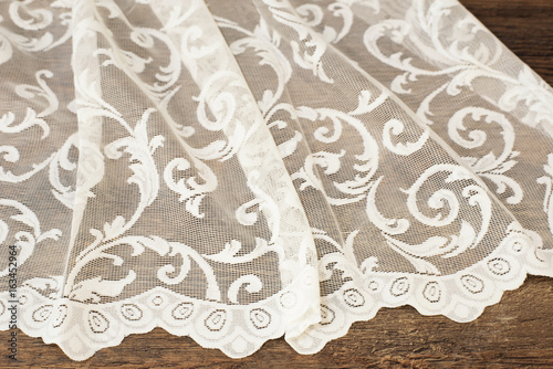 Close up of Beautiful White Tulle. Sheer Curtains Fabric Sample. Texture, Background, Pattern. Wedding Concept. Interior Design. Vintage Lace Tulle Chiffon