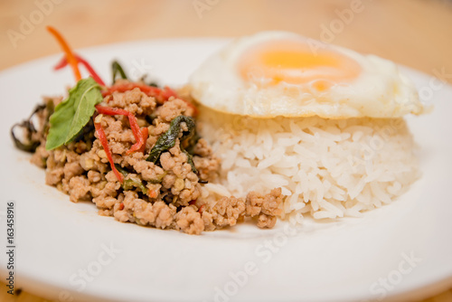 stir-fried pork and basil and fried egg with rice, Thai food