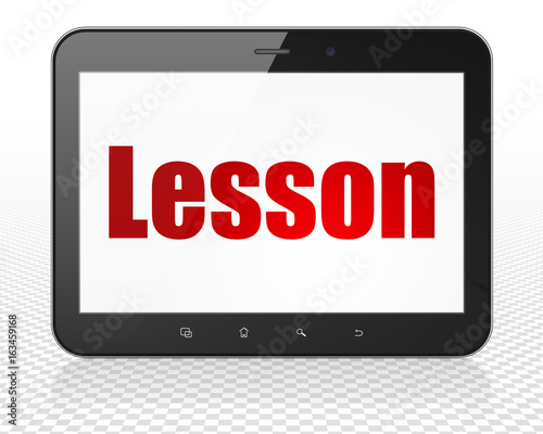 Learning concept: Tablet Pc Computer with Lesson on display