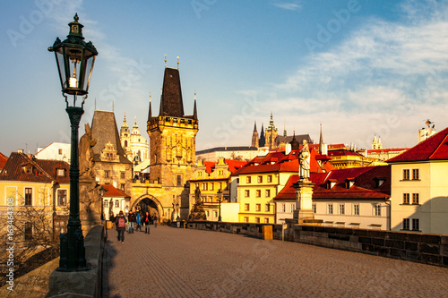 Charles Bridge with Lesser Town Bridge Tower and Prague Castle on background. Sunny morning in Prague  Czech Republic.
