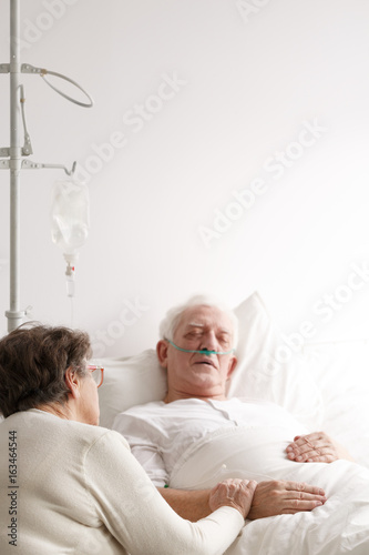 Senior man and his wife in hospital