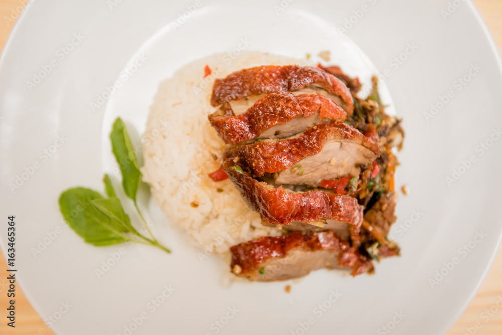 stir-fried roasted duck and basil and fried egg with rice, Thai food