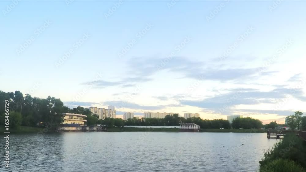 wooden walkway along the lake in park timelapse wooden walkway along the lake in park timelapse
