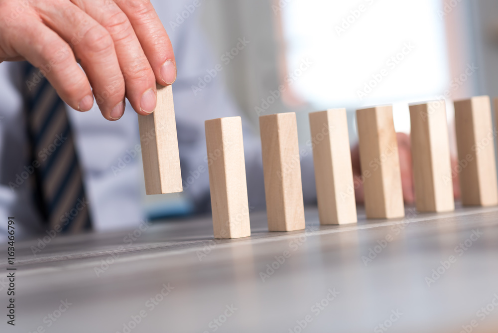 Concept of business progress with wood blocks