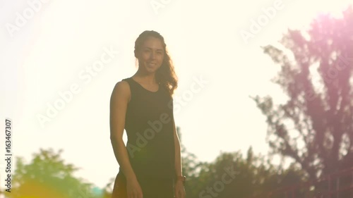 Sport girl near stadium seats photo