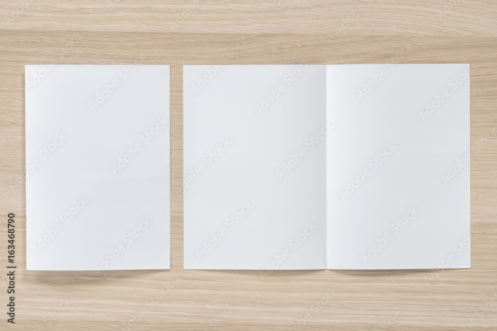 Mock up flyer pamphlet brochure design A4 size half-folded (A5) paper  layout space for template illustration mockup, flat lay on wood table from  top view Stock-Foto | Adobe Stock