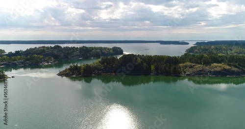 Islands, Cinema 4k aerial view above small islands in kemionsaari archipelago, in the saaristo of Varsinais-suomi, Finland photo