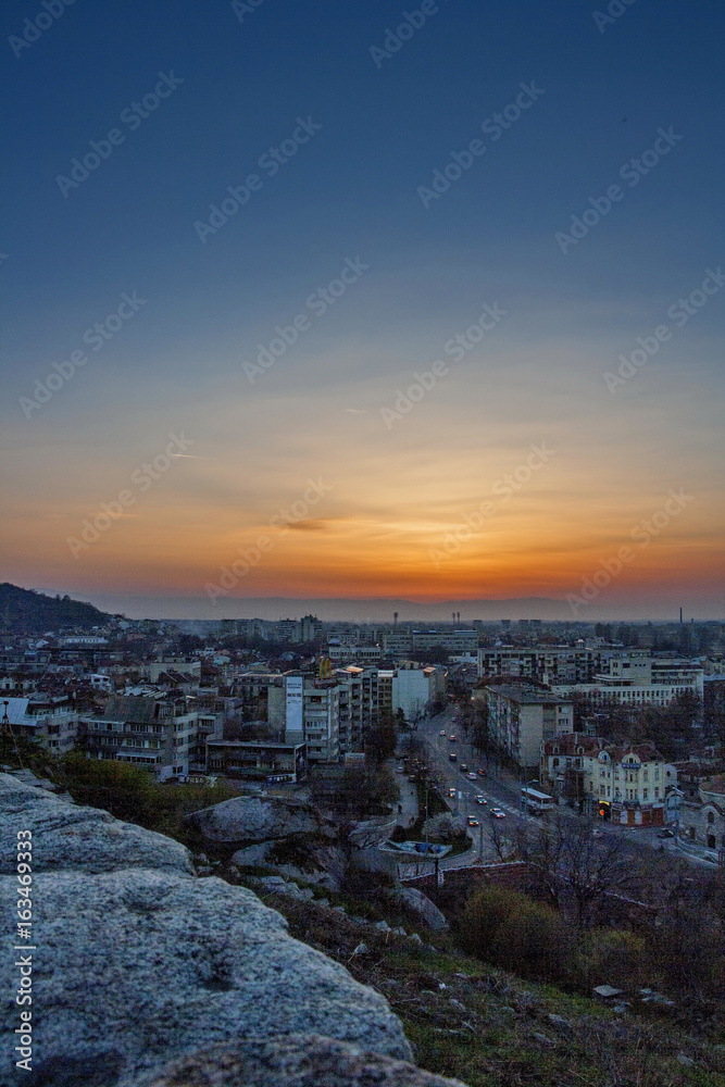 Evening with setting sun above the town