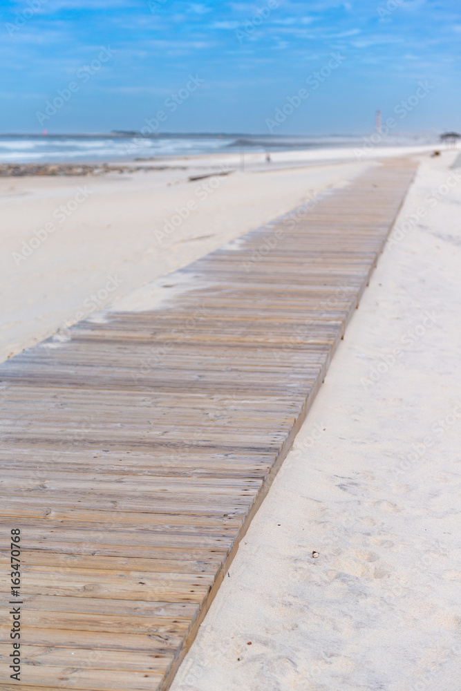 Beach path between sand dunes at Costa Nova beach. Aveiro.  Portugal