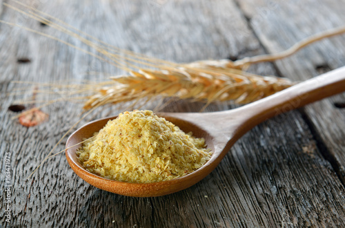 Fotografie Wheat germ in wood spoon