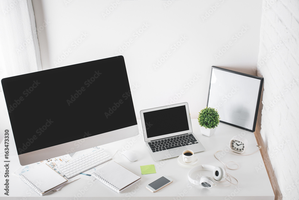 Office desktop with computer and laptop Office desktop with computer and laptop