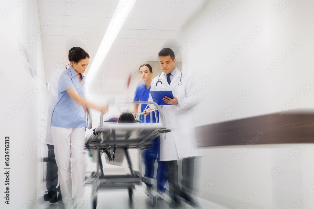 medics and patient on hospital gurney at emergency medics and patient on hospital gurney at emergency
