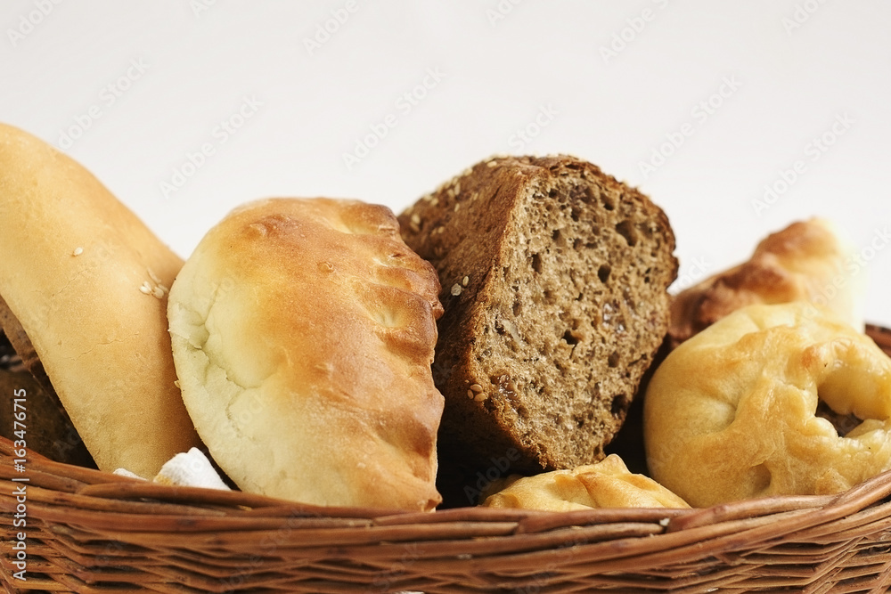 Bakery products in a wicker basket  close-up