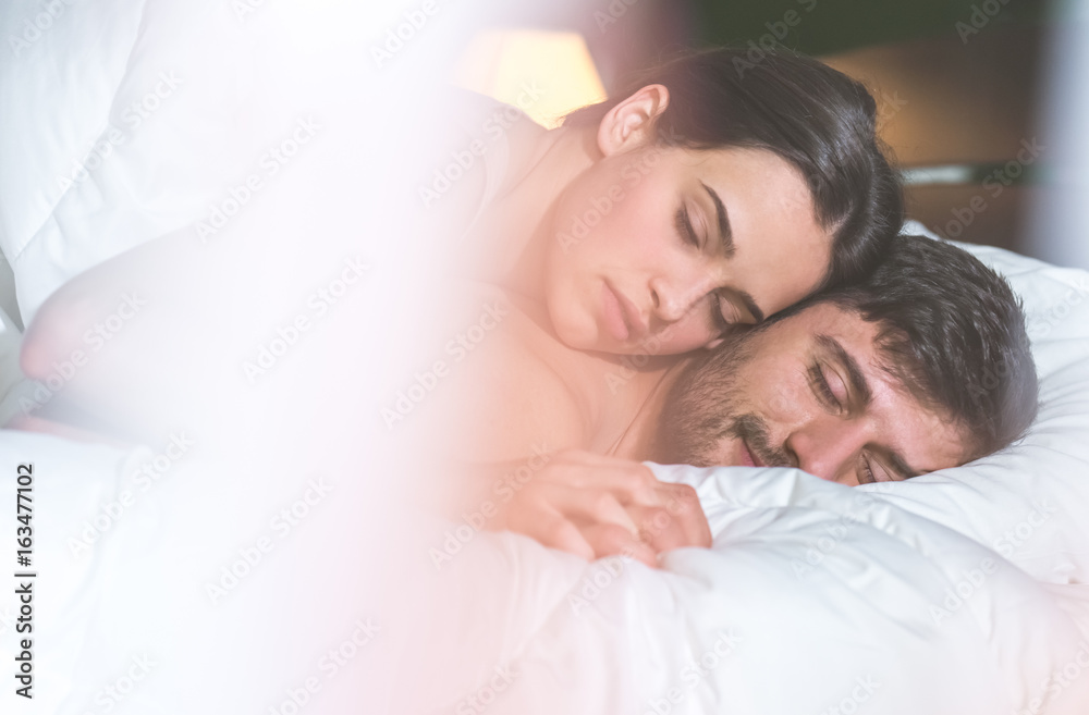 The young couple relax in the bed The young couple relax in the bed