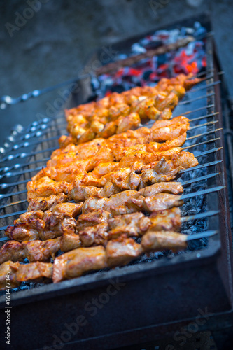 Barbecue. Fried shish kebab from pork meat. Fried chicken meat. Lamb on charcoal