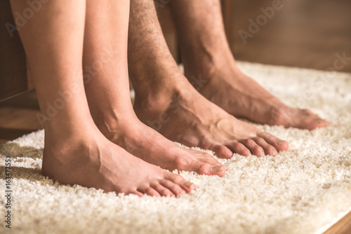 The couple of legs on the carpet © realstock1