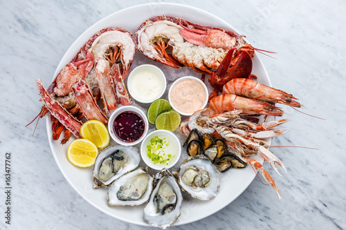 Fresh seafood platter with lobster, mussels and oysters photo
