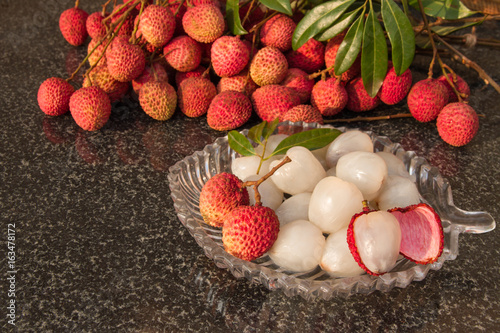 Fresh juicy lychee fruit on a glass plate. Organic leechee sweet fruit. Organic fruit concept. Exotic tropical litschi berry. Peeled lychee fruit. Selective focus. 