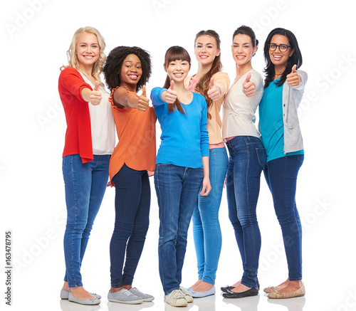international group of women showing thumbs up