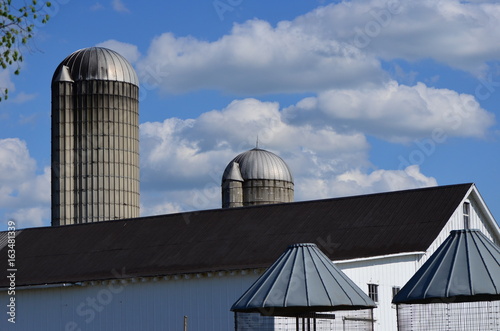 Rooftops of barn, silos and corn cribs