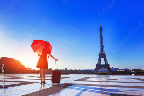 Canvas Print Girl with stylish red clothes, umbrella, suitcase, Eiffel Tower, fashion