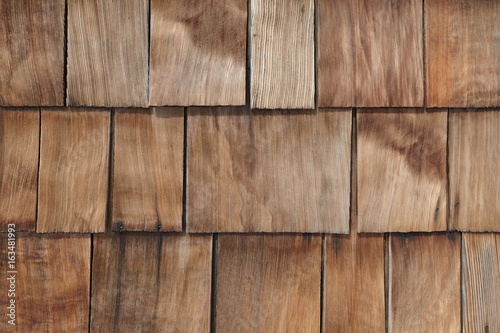 Natural unpainted old house branchy wood wallboard pattern background.