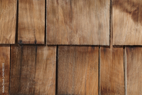 Natural unpainted old house branchy wood wallboard pattern background. photo