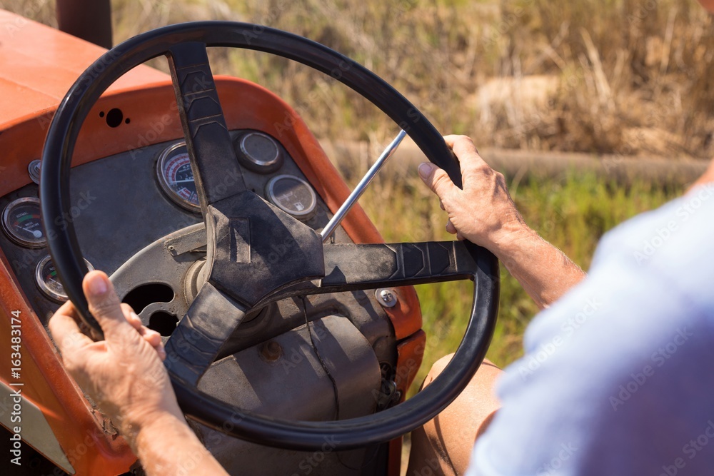Close-up of woman driving tractor in olive farm Close-up of woman driving tractor in olive farm