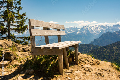 Empty wooden bench in the bavarian alps