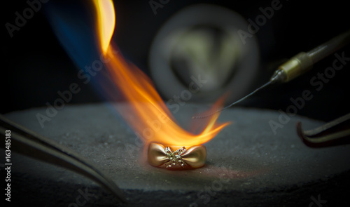 The jeweler solder the ring.