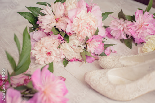 Flowers bouquet pink peone with shoes photo