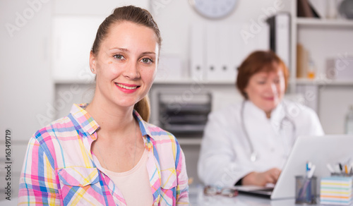 Adult female doctor leading medical appointment